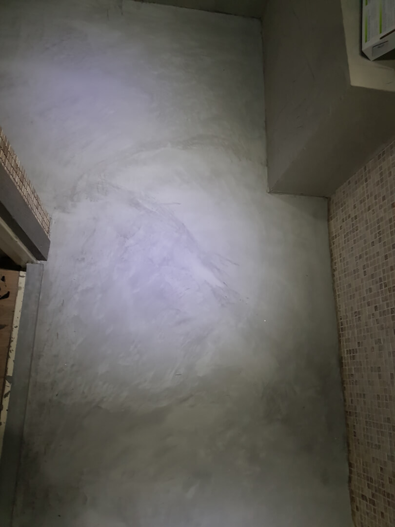 Detail van handmatig aangebrachte beton ciré